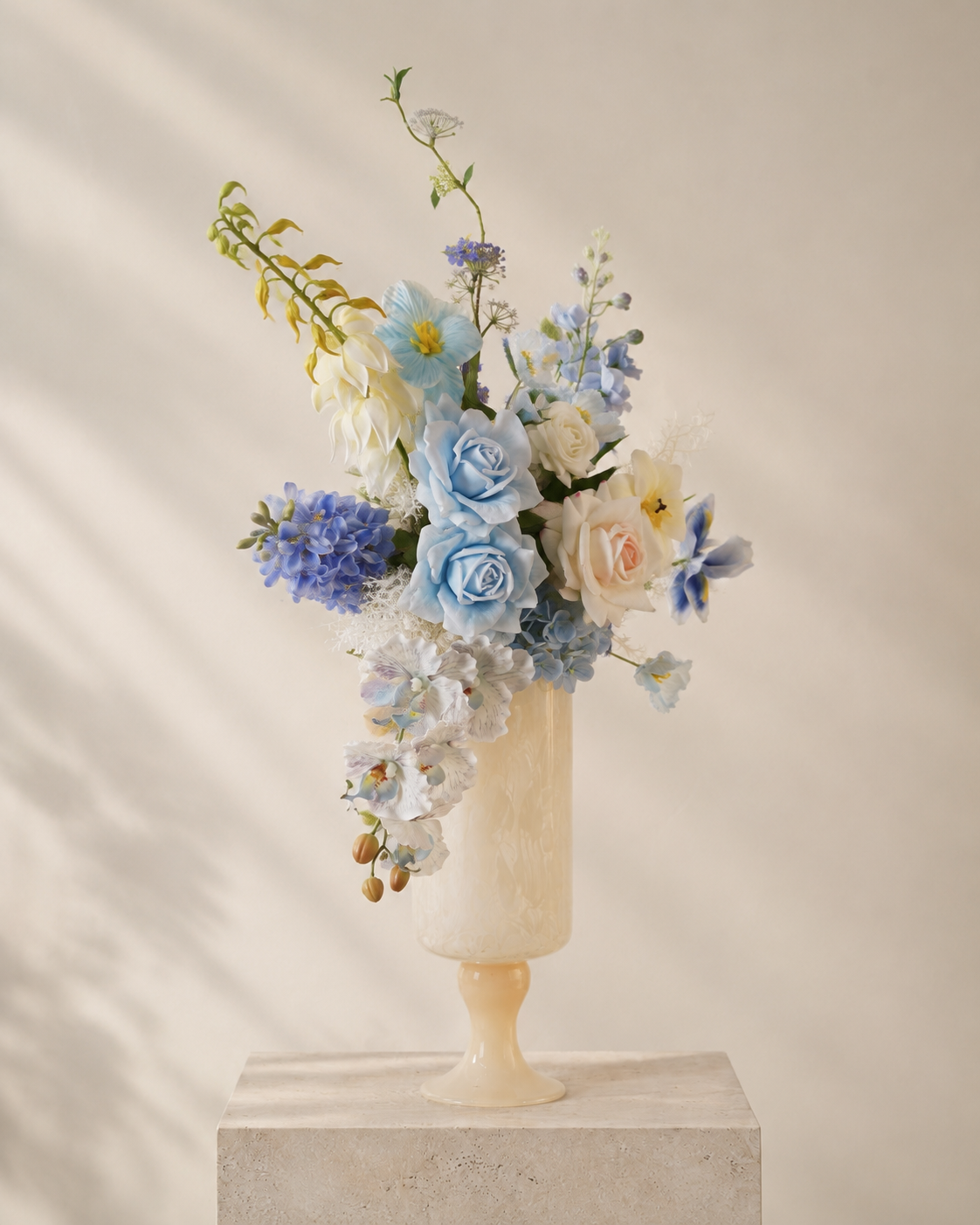 Blue & White Faux Floral Arrangement in Ivory Pedestal Glass Vase