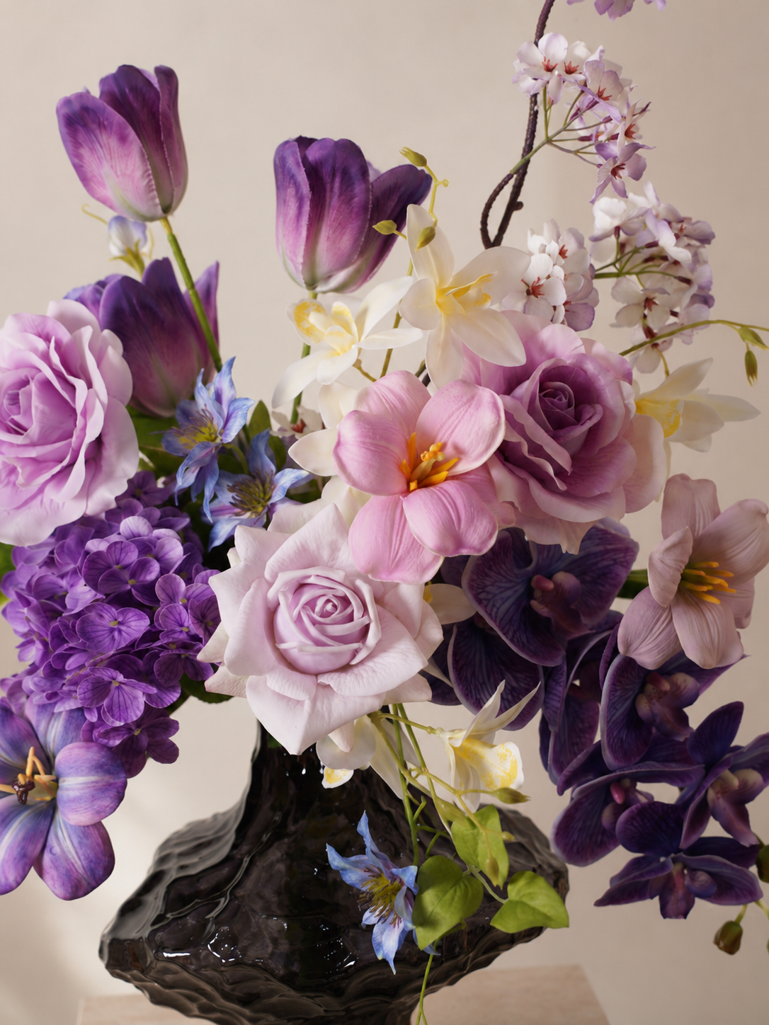 Purple Tulip & Orchid Faux Floral Arrangement in Clear Sculptural Glass Vase