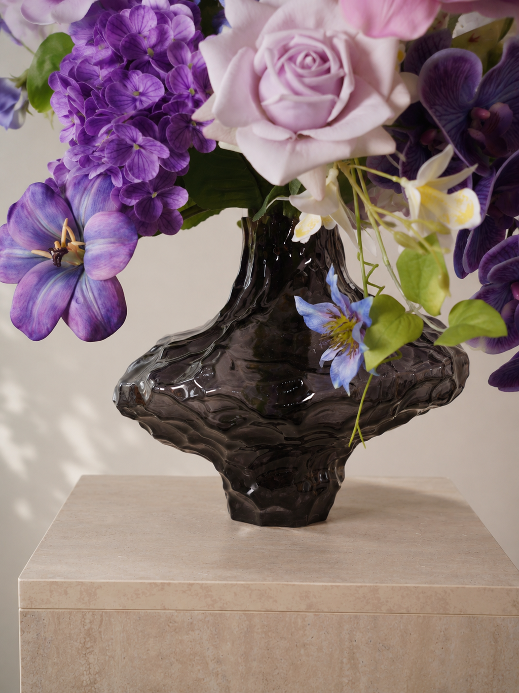 Purple Tulip & Orchid Faux Floral Arrangement in Clear Sculptural Glass Vase