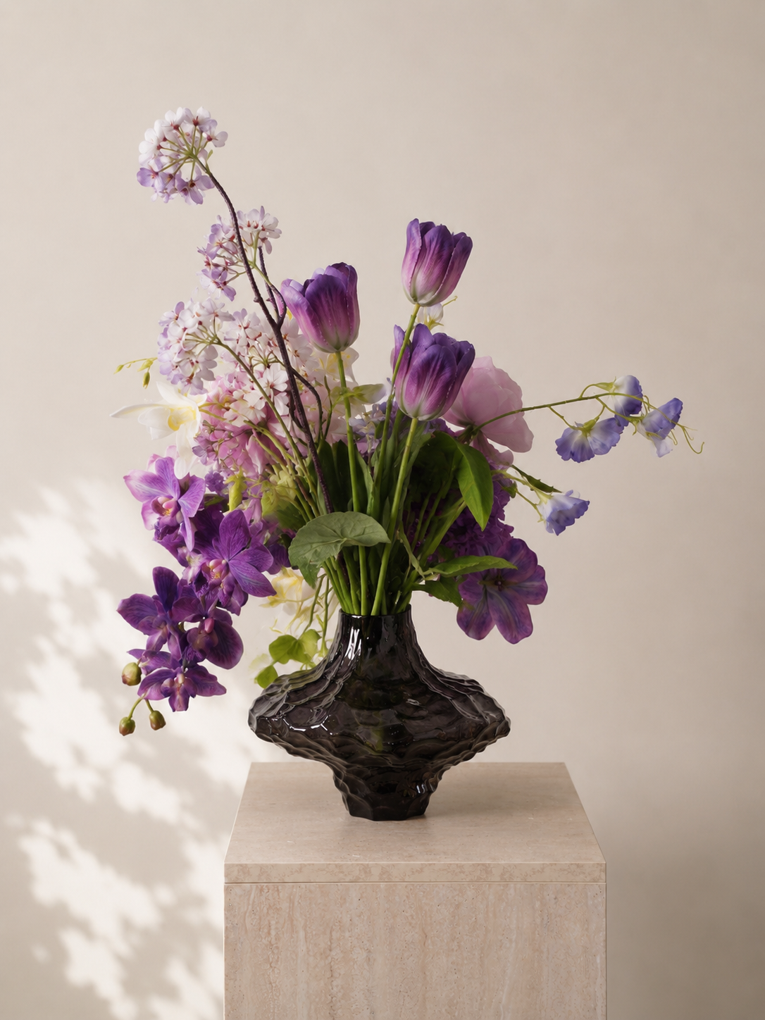 Purple Tulip & Orchid Faux Floral Arrangement in Clear Sculptural Glass Vase