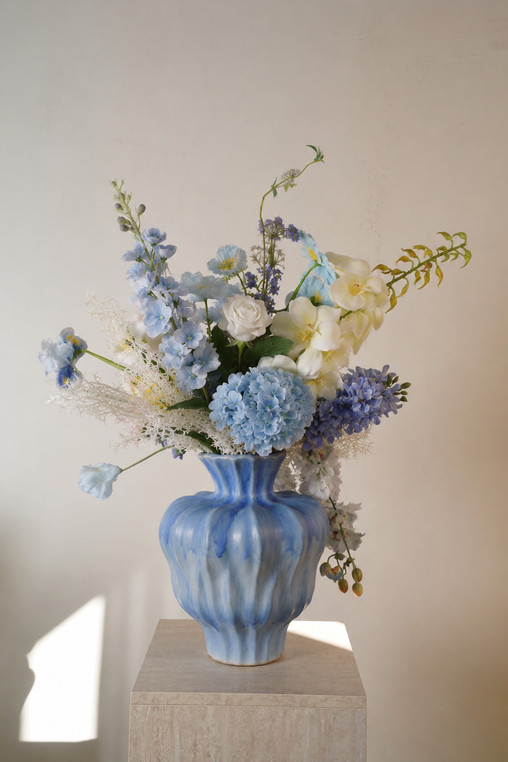 Blue Hydrangea & Rose Faux Floral Arrangement in Sculptural Blue Ceramic Vase